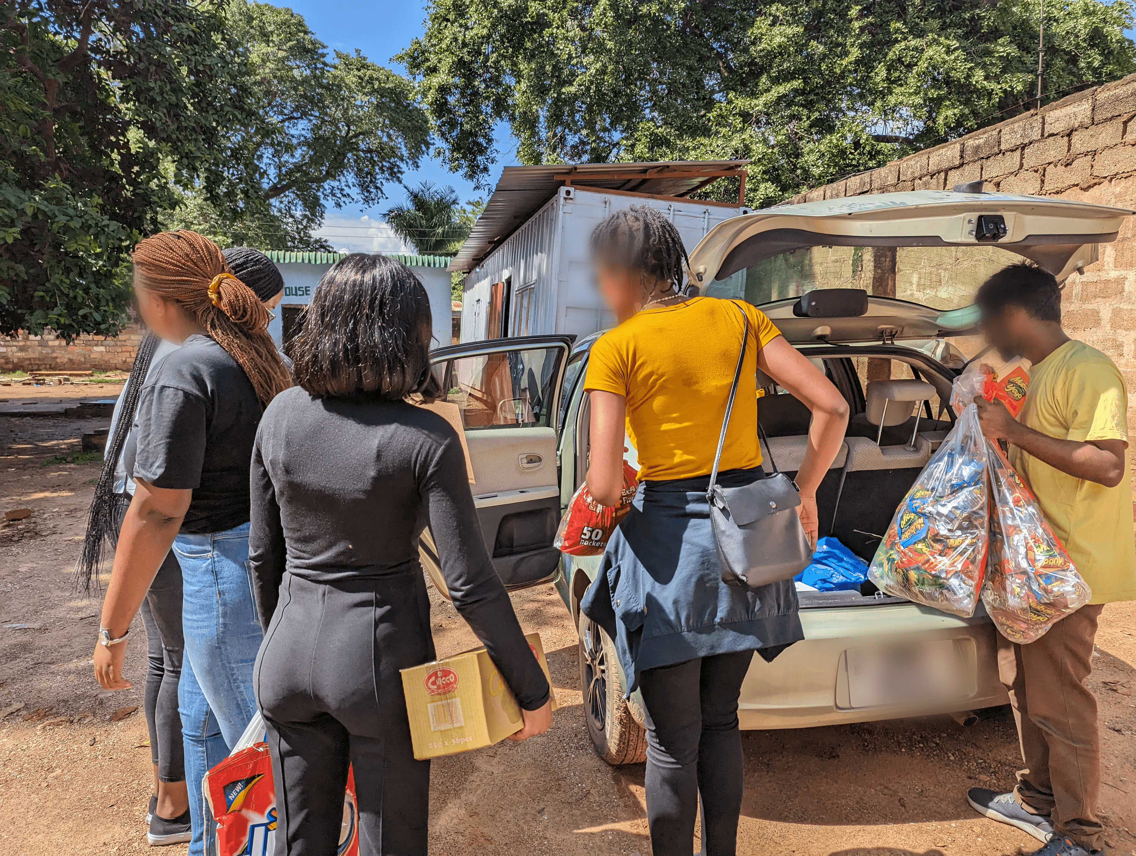 Distributing donations to the boys at Nsansa Village