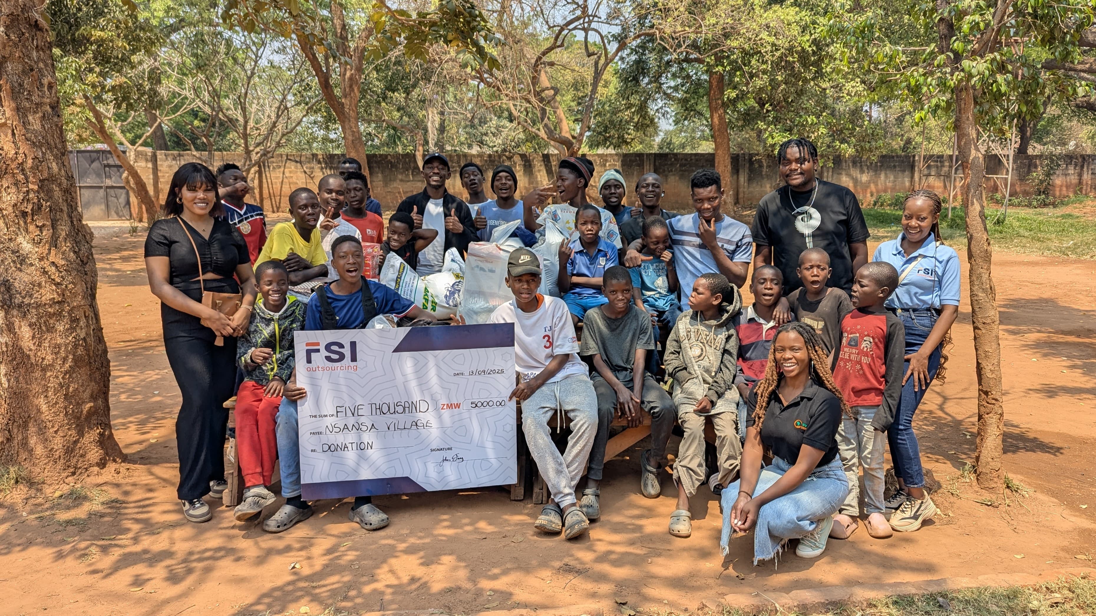 A picture of the boys receiving our donation at Nsansa Village